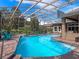 Enjoy swimming year-round with this home's stunning screened pool and spa in a private backyard at 3619 King George Dr, Orlando, FL 32835