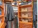 Organized walk-in closet with shelves, hanging racks, and drawers providing plenty of storage space at 3619 King George Dr, Orlando, FL 32835