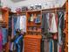 Spacious walk-in closet with custom shelving and ample storage for clothes, shoes, and accessories at 3619 King George Dr, Orlando, FL 32835