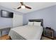 Comfortable bedroom featuring a ceiling fan, closet, and a window for natural light at 401 Gannet Ct, Kissimmee, FL 34759