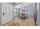 Open dining area with tile floors, modern lighting and a round glass-top table at 401 Gannet Ct, Kissimmee, FL 34759