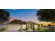 Charming single-Gathering home features a well-manicured lawn and inviting curb appeal at 401 Gannet Ct, Kissimmee, FL 34759