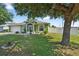 Charming single Gathering home features a well-manicured lawn and beautiful front yard landscaping at 401 Gannet Ct, Kissimmee, FL 34759