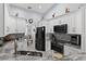 Kitchen with stainless steel appliances, white cabinets, granite countertops and modern backsplash at 401 Gannet Ct, Kissimmee, FL 34759