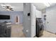 Bright laundry room features a modern washer and dryer, storage cabinets, and a convenient layout at 401 Gannet Ct, Kissimmee, FL 34759