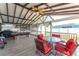 Covered patio with comfortable seating and a pool table offering a great outdoor entertainment space at 401 Gannet Ct, Kissimmee, FL 34759