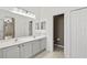 Light and bright bathroom with double sinks, soaking tub, and stylish floor tiles at 413 Pursley Dr, Deland, FL 32724
