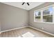 Light and airy bedroom with ceiling fan and wood floors at 413 Pursley Dr, Deland, FL 32724
