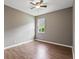 Standard bedroom with wood floor and ceiling fan at 413 Pursley Dr, Deland, FL 32724