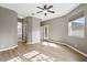 Spacious bedroom with en suite bathroom, ceiling fan and light-colored wood flooring at 413 Pursley Dr, Deland, FL 32724