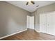 Bedroom boasts wood floors and a convenient closet at 413 Pursley Dr, Deland, FL 32724