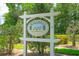 Community sign 'Victoria Commons' set amongst mature trees and landscaping offers a welcoming entrance at 413 Pursley Dr, Deland, FL 32724