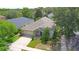 Aerial view of a well-maintained single-Gathering home with a beautifully landscaped yard and attached garage at 413 Pursley Dr, Deland, FL 32724