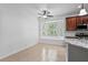 Kitchen features a large window with a seat, stainless appliances, and beautiful tiled floors at 413 Pursley Dr, Deland, FL 32724