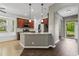 Well-lit kitchen boasts granite countertops, stainless appliances, tile backsplash and rich, dark wood cabinetry at 413 Pursley Dr, Deland, FL 32724