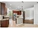 The updated kitchen includes granite countertops, stainless appliances, and dark wood cabinets at 413 Pursley Dr, Deland, FL 32724
