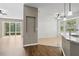 Open-concept space with a view into the kitchen area featuring light countertops and stainless appliances at 413 Pursley Dr, Deland, FL 32724