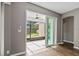 View from inside to enclosed patio with backyard play set at 413 Pursley Dr, Deland, FL 32724