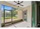 Screened patio with access to the backyard and playset at 413 Pursley Dr, Deland, FL 32724
