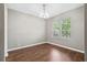 The space features hard wood floors, neutral paint, and a large window with natural light at 413 Pursley Dr, Deland, FL 32724