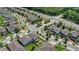 Overhead image showing houses in a neighborhood with sidewalks, streets, and landscaping near a treelined highway at 4301 Creek Bank Dr, Kissimmee, FL 34744
