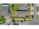 Aerial view showcasing the property's layout, backyard with a playground, and proximity to neighboring houses at 4301 Creek Bank Dr, Kissimmee, FL 34744