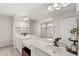 Bathroom with double sink vanity, quartz countertop, and large mirror at 4301 Creek Bank Dr, Kissimmee, FL 34744