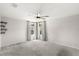 Spacious bedroom with plush carpet, ceiling fan and abundant natural light at 4301 Creek Bank Dr, Kissimmee, FL 34744
