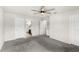 Neutral bedroom with two doors, a ceiling fan, and gray carpet at 4301 Creek Bank Dr, Kissimmee, FL 34744