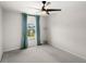 Comfortable bedroom featuring a ceiling fan and scenic view from the window at 4301 Creek Bank Dr, Kissimmee, FL 34744
