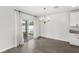 Dining area features sliding glass doors to the patio and an elegant chandelier at 4301 Creek Bank Dr, Kissimmee, FL 34744