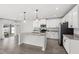 Open-concept kitchen featuring granite counters, an island, stainless appliances and sliding door access at 4301 Creek Bank Dr, Kissimmee, FL 34744