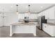 Modern kitchen featuring an island, stainless steel appliances, and granite countertops at 4301 Creek Bank Dr, Kissimmee, FL 34744