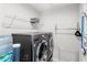 This laundry room is equipped with modern washer and dryer at 4301 Creek Bank Dr, Kissimmee, FL 34744