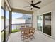 This covered outdoor patio features a ceiling fan and backyard at 4301 Creek Bank Dr, Kissimmee, FL 34744