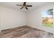 This inviting bedroom features a modern ceiling fan and wood-look flooring at 435 Boxwood Cir, Winter Springs, FL 32708