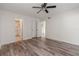 Bedroom featuring wood-look flooring, a ceiling fan and two large closets at 435 Boxwood Cir, Winter Springs, FL 32708