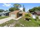 Charming home featuring a well-maintained lawn, garage, and inviting entrance at 435 Boxwood Cir, Winter Springs, FL 32708