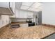 Bright kitchen with granite countertops, stainless steel sink, and sleek appliances at 435 Boxwood Cir, Winter Springs, FL 32708