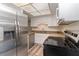 This eat-in kitchen features stainless steel appliances, granite counters, and white cabinetry at 435 Boxwood Cir, Winter Springs, FL 32708