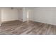 Spacious living room with wood-look flooring and a closet for storage at 435 Boxwood Cir, Winter Springs, FL 32708