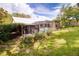 Expansive backyard featuring a screened pool area and mature greenery, perfect for outdoor entertaining at 452 Sundown Trl, Casselberry, FL 32707