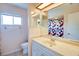 Bright bathroom with a single sink vanity and a shower/tub combo with patterned curtain at 452 Sundown Trl, Casselberry, FL 32707