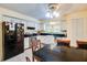 Bright kitchen features white cabinetry, black appliances, a breakfast nook, and a lovely window view at 452 Sundown Trl, Casselberry, FL 32707