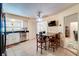 Eat-in kitchen boasting stainless steel appliances and a breakfast area with a granite-topped table at 452 Sundown Trl, Casselberry, FL 32707