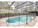 Beautiful in-ground pool with screened enclosure, offering privacy and a refreshing escape from the summer heat at 452 Sundown Trl, Casselberry, FL 32707