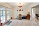 Versatile sunroom with French doors, a neutral color palette, and potential for a home office or studio at 452 Sundown Trl, Casselberry, FL 32707