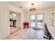 Charming sunroom leads to a backyard oasis, with a view of the kitchen and natural light at 452 Sundown Trl, Casselberry, FL 32707