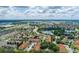 Beautiful aerial view of community with mature trees, ponds, and a highway nearby at 5259 Images Cir # 301, Kissimmee, FL 34746