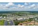 Aerial view of a residential area with shopping centers and commercial buildings at 5259 Images Cir # 301, Kissimmee, FL 34746